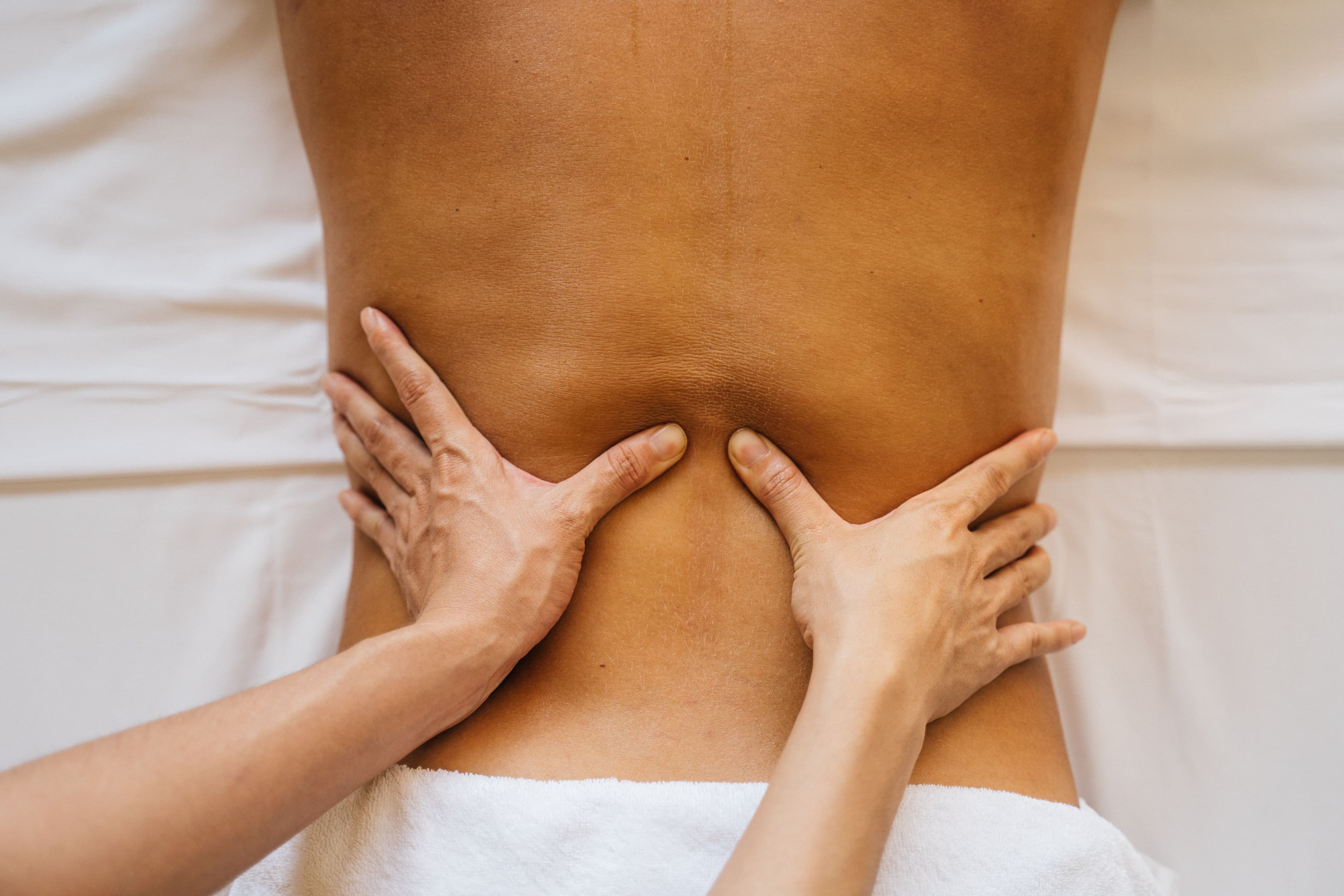 Close-up of a holistic massage treatment in Tenerife, showing intentional, therapeutic touch